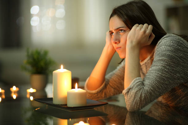 Astrologer reading a birth chart beneath a star-filled sky